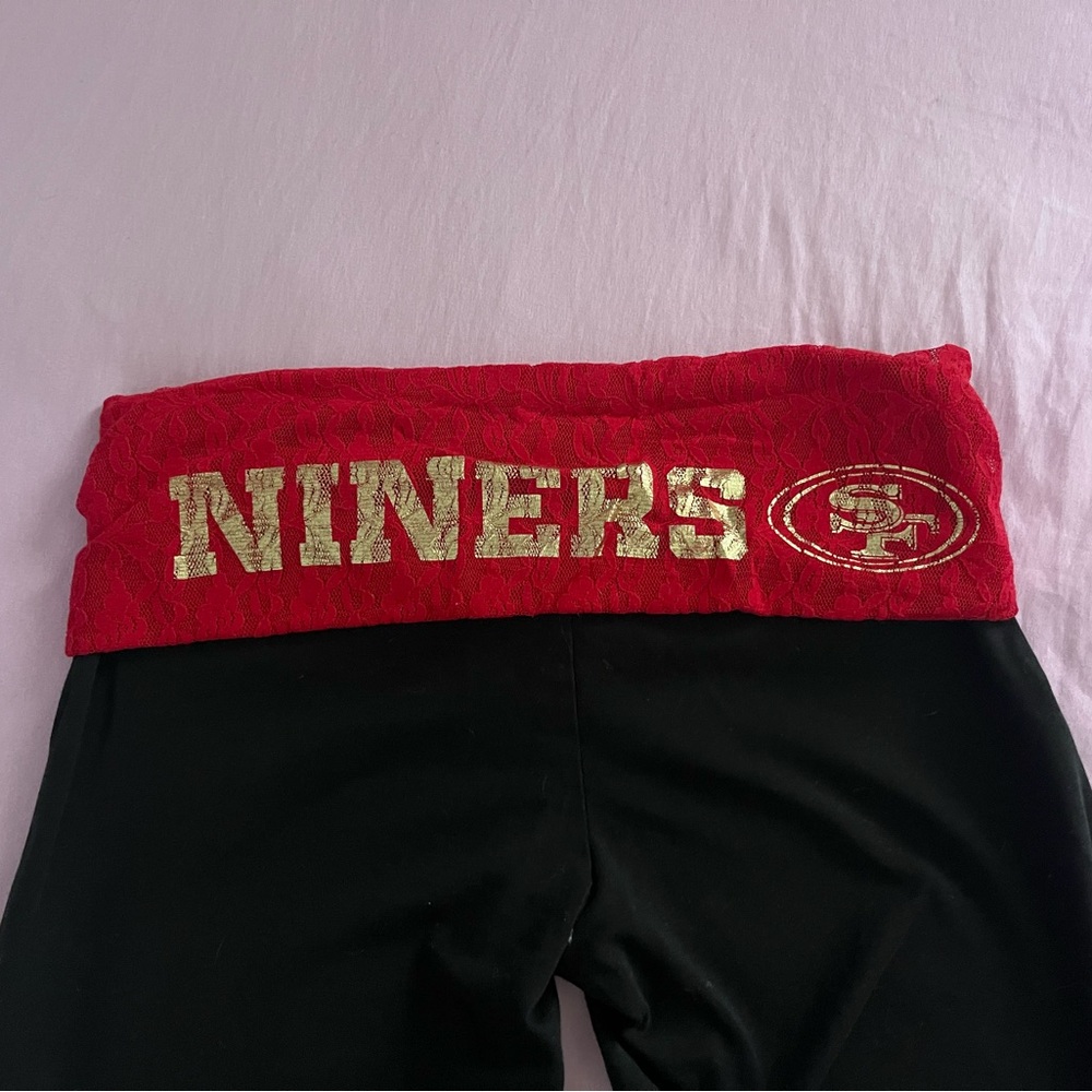 VS PINK 49ERS FLARED LEGGINGS